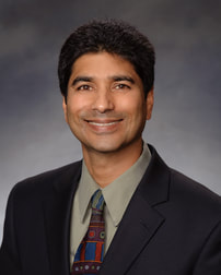 Portrait of Abe Hajela, Partner at Capitol Advisors Group